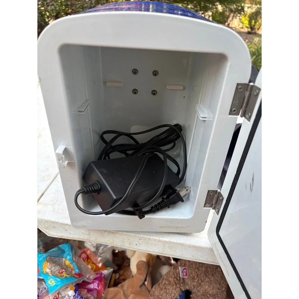 Sunbeam mini-fridge, a compact and portable cooling and warming unit.